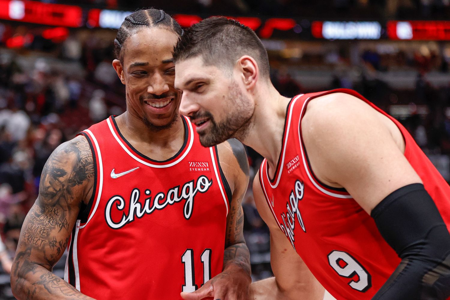 Chicago Bulls center Nikola Vucevic celebrates with forward DeMar DeRozan
